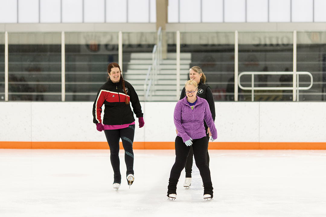 Michele Wells (back, right) takes a turn on the ice with Becky (left) and Chelsea (right), who skated with Wells in the Spring Ice Show.
