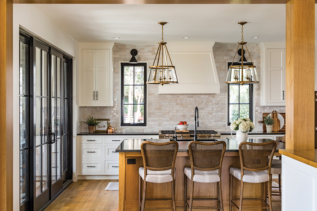 The kitchen features warm wood tones, with wooden posts and beams made from rift-sawn white oak.