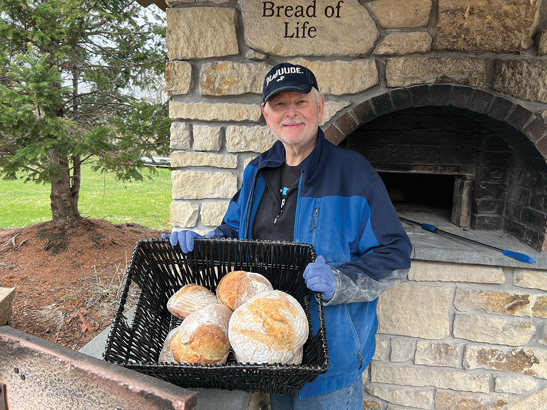 Volunteer making bread for Baking with a Purpose