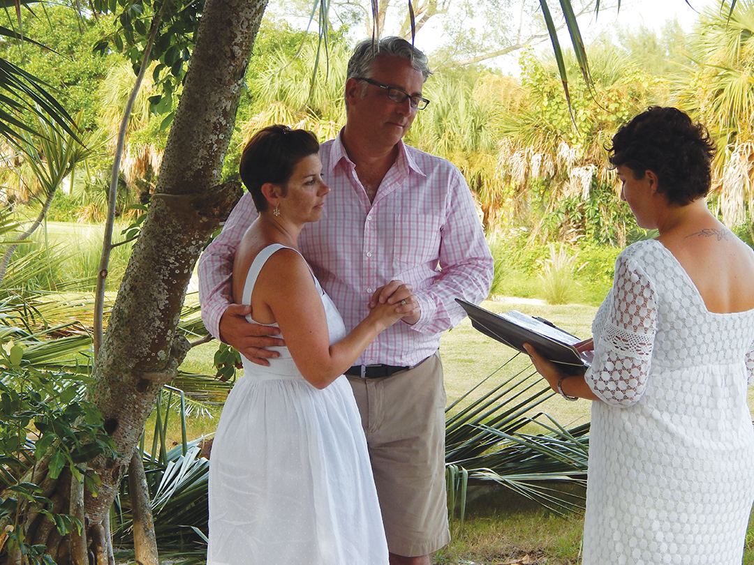 Kelly Koerpel leads Debby and Jim Dalfonso through their vow renewal ceremony at a golf course in Florida.