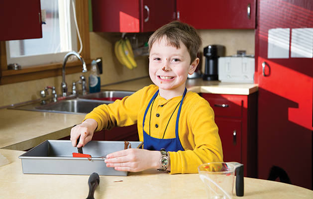 Ray having fun and getting messy while making brownies at home. 