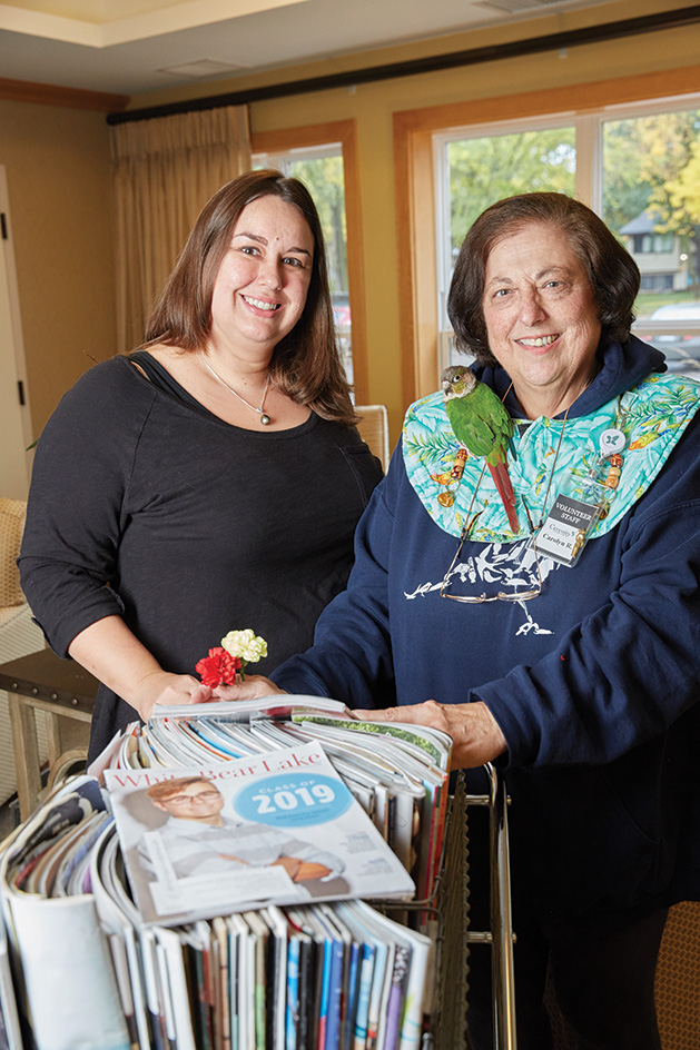 Volunteer coordinator Mirah Van Duuren, left, with volunteer Carolyn Roberts.