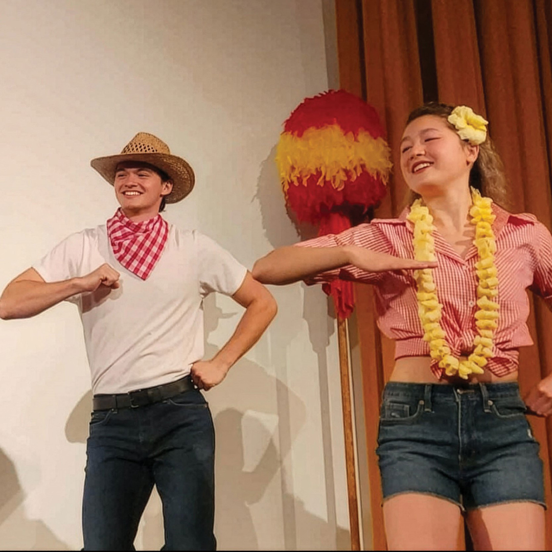 Alexis (right) performing at the Ho’ike retirement celebration for Kalei Enstad.