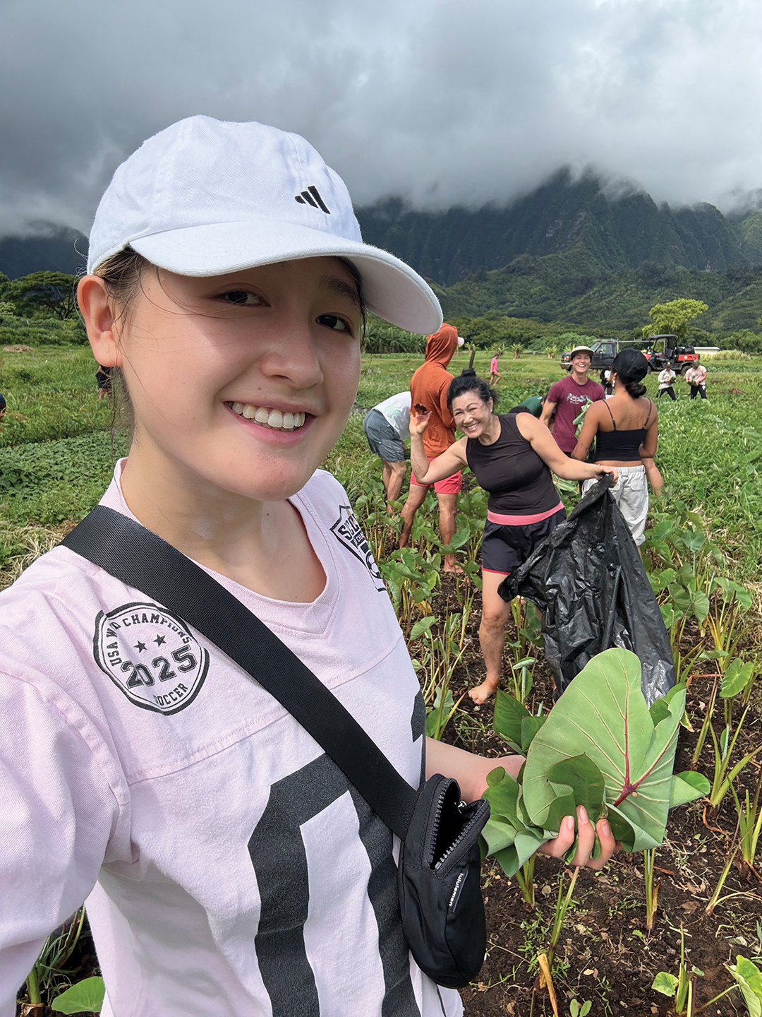 Alexis volunteers in a taro patch on the island of O’ahu in July 2025.