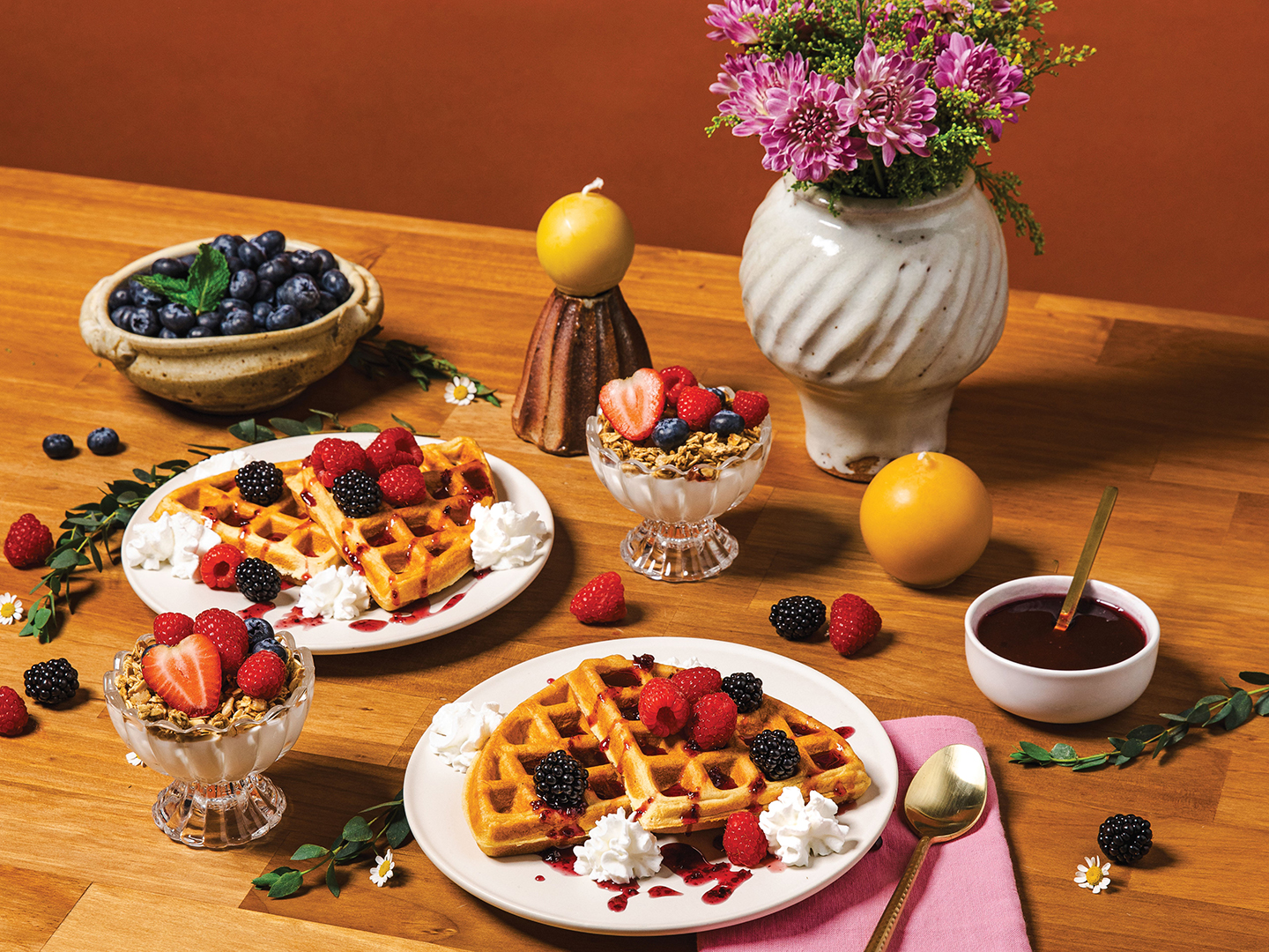There’s nothing better than a breakfast spread featuring local berries and blooms. Start your day off with mouthwatering waffles, topped with berries and whipped cream, or a berry parfait. Bowl and vases by Olivia Jenson, oliviajenson.com; Candles by Hilltop Handmade Goods, @hilltopgoodsmn
