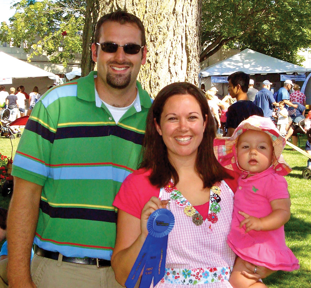 Alice Seuffert, center, stands with her husband, Will Seuffert, and daughter, Stella, holding a blue ribbon for her French Toast Stuffed Pork. The picture was taken after the dish was demonstrated on Twin Cities Live at the Minnesota State Fair.